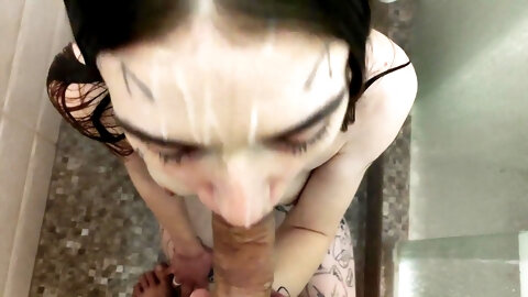 Wet cutie sucks cock in the shower before massive facial